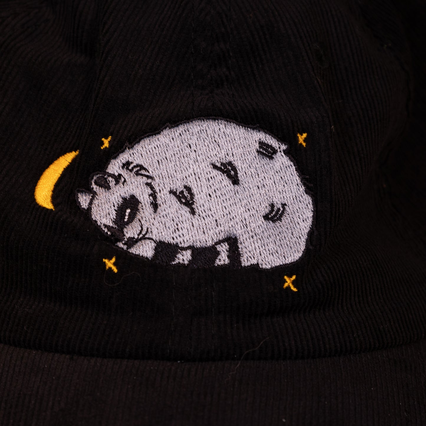 Sleepy Raccoon Black Embroidered Corduroy Cap